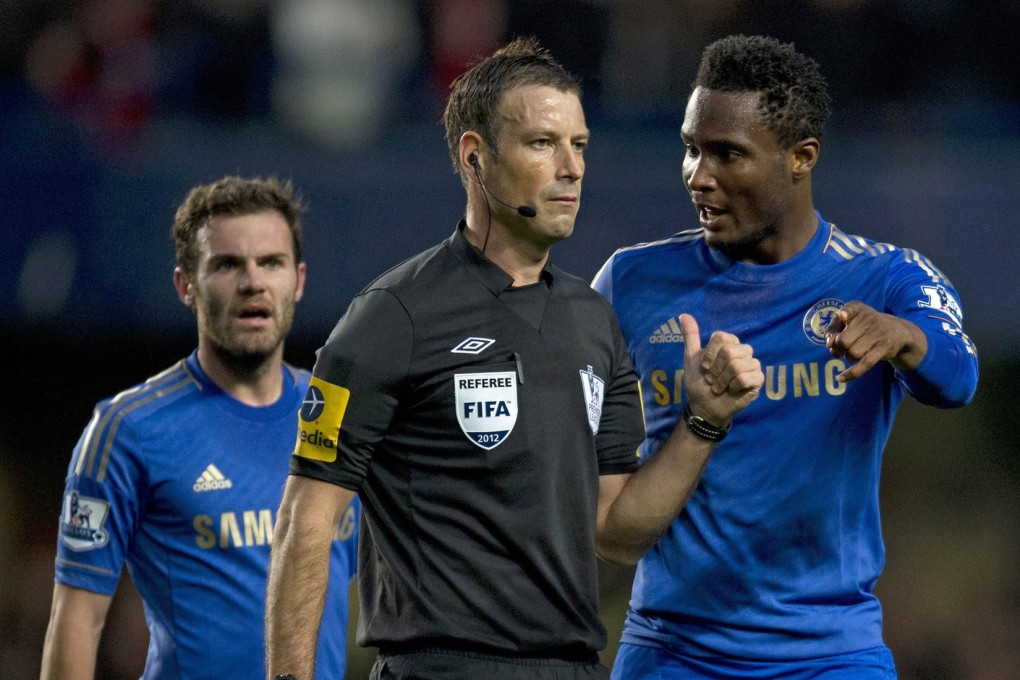 Chelsea's midfielder John Mikel Obi talking with referee Mark Clattenburg during a match against Manchester United earlier this month. There were complaints about racist comments during the game. Photo: AFP