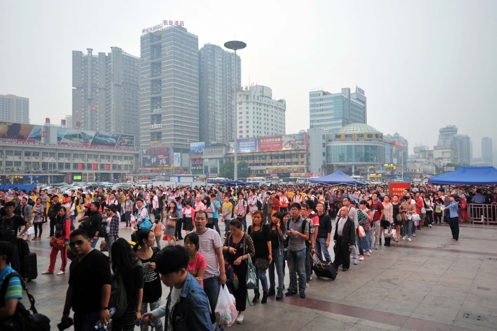 Passengers queue up to enter the Changsha Railway Station in the capital of Hunan province on Monday. Photo: Xinhua