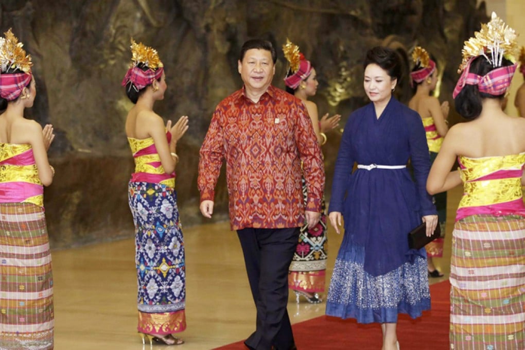 Xi Jinping sports his Balinese shirt at the Apec dinner. Photo: AFP