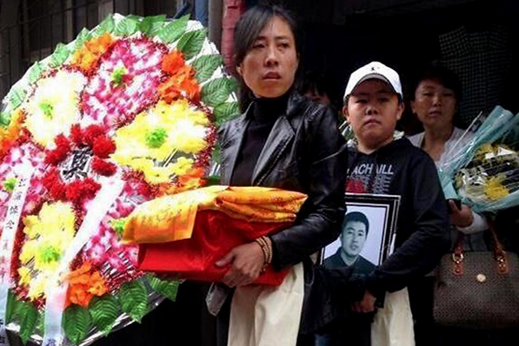 Zhang Jing attends the funeral of her husband, Xia Junfeng, who was executed in Shenyang in Liaoning province. Photo: SCMP
