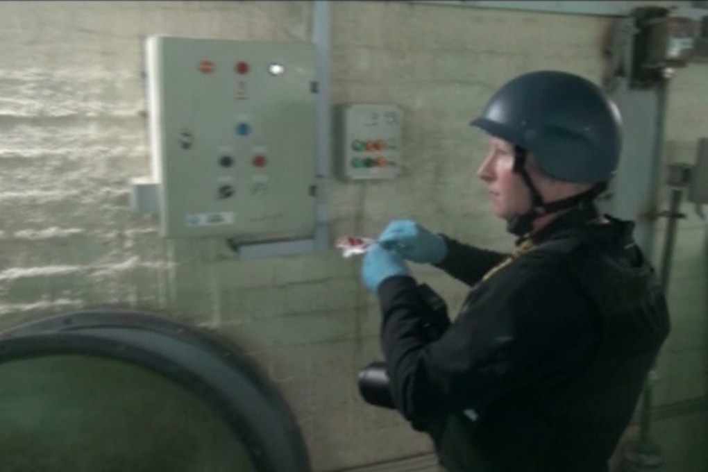 A UN disarmament inspectors works at an undisclosed location in Syria. Photo: EPA