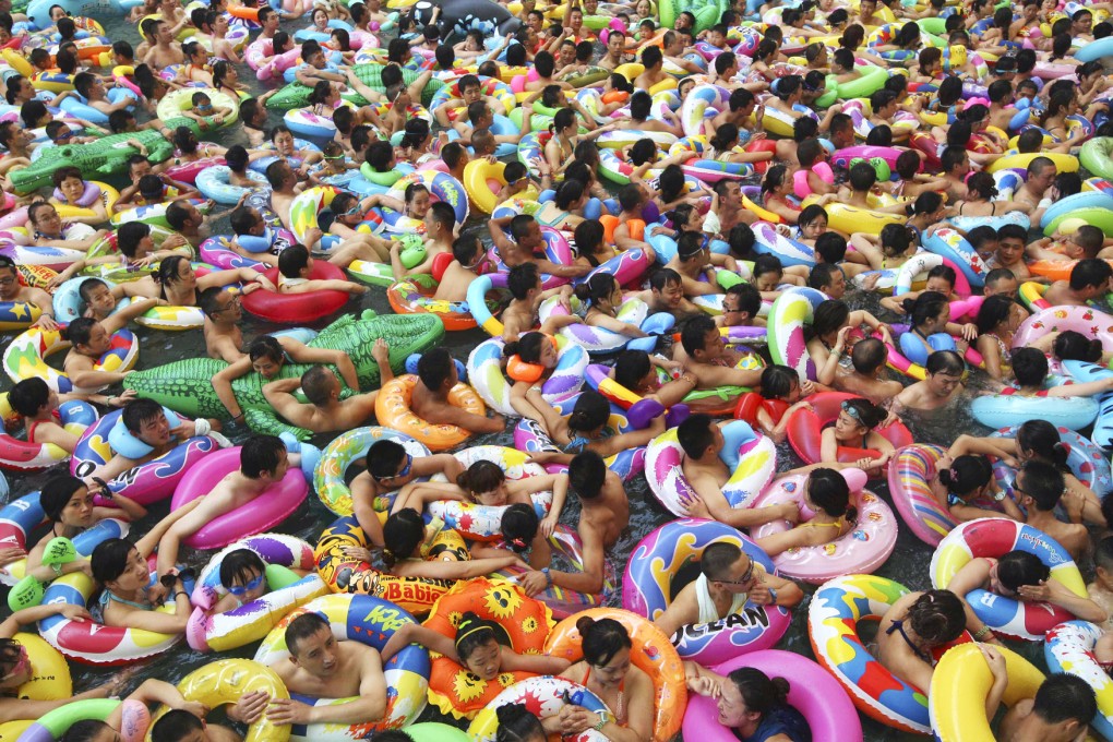 Visitors crowd a pool to escape the summer heat in Sichuan in August this year. Photo: Reuters