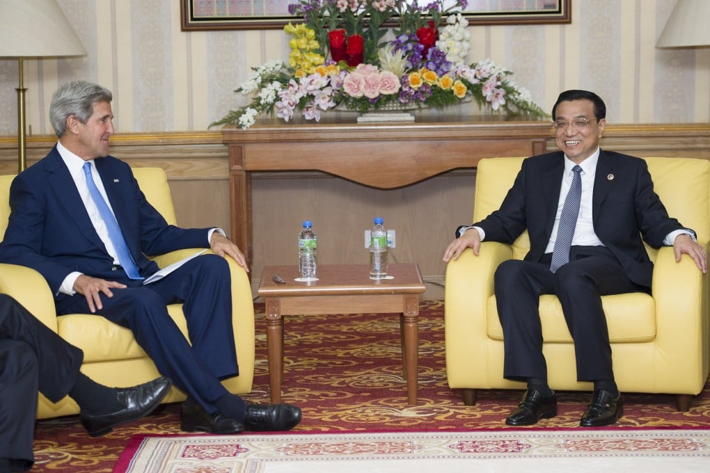 Chinese Premier Li Keqiang meets with US Secretary of State John Kerry in Bandar Seri Begawan. Photo: Xinhua
