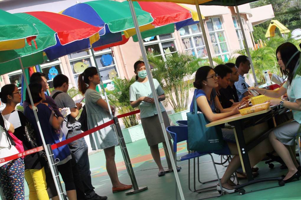 Parents queue for application form for Fung Kai Kindergarten in Sheung Shui. Photo: K.Y. Cheng