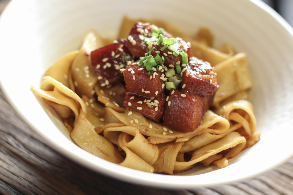 Egg noodles with pork belly (above), and Taiwanese-style crispy chicken wings (below) at Mian. Photos: Nora Tam