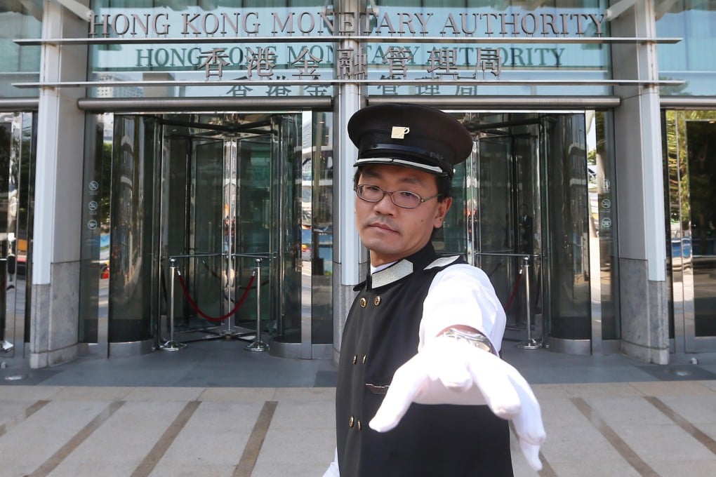 This security guard is not the only person at the Monetary Authority monitoring events. Photo: Sam Tsang