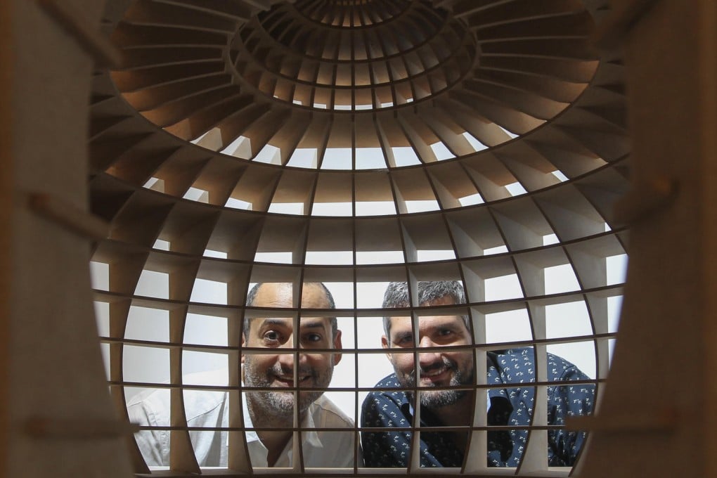Marco Antonio Castillo Valdés (left) and Dagoberto Rodriguez Sánchez, with their work Octogonal (2013). Photo: May Tse