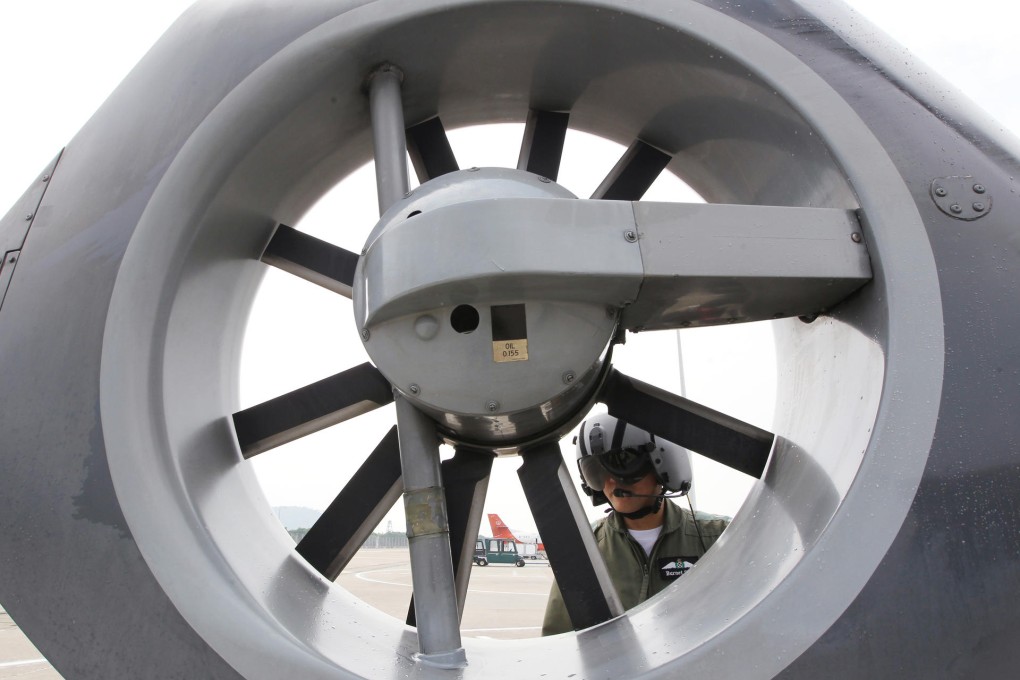 Burnet Shek Tat-ching checks and prepares before flying from the GFS headquarters at Chek Lap Kok airport. Photo: Nora Tam