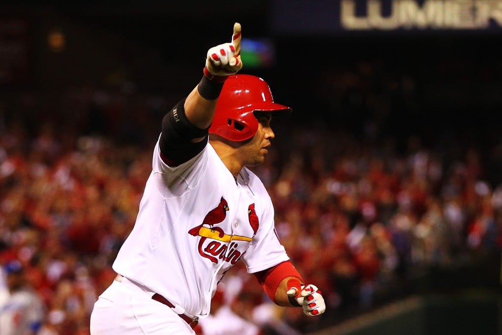 Carlos Beltran of the St Louis Cardinals celebrates after his game-winning hit in the 13th inning against the Los Angeles Dodgers. Photo: AFP