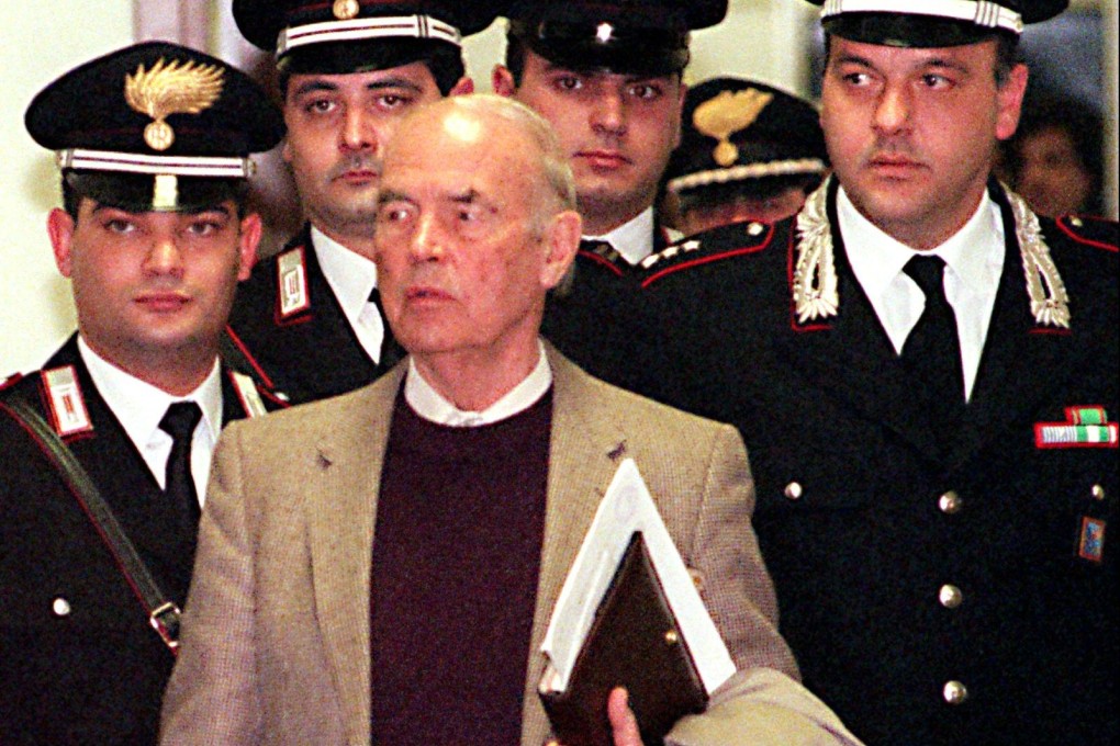Former Nazi SS officer Erich Priebke enters a military court in Rome in 1995 before being sentenced to life for war atrocities. Photo: AP
