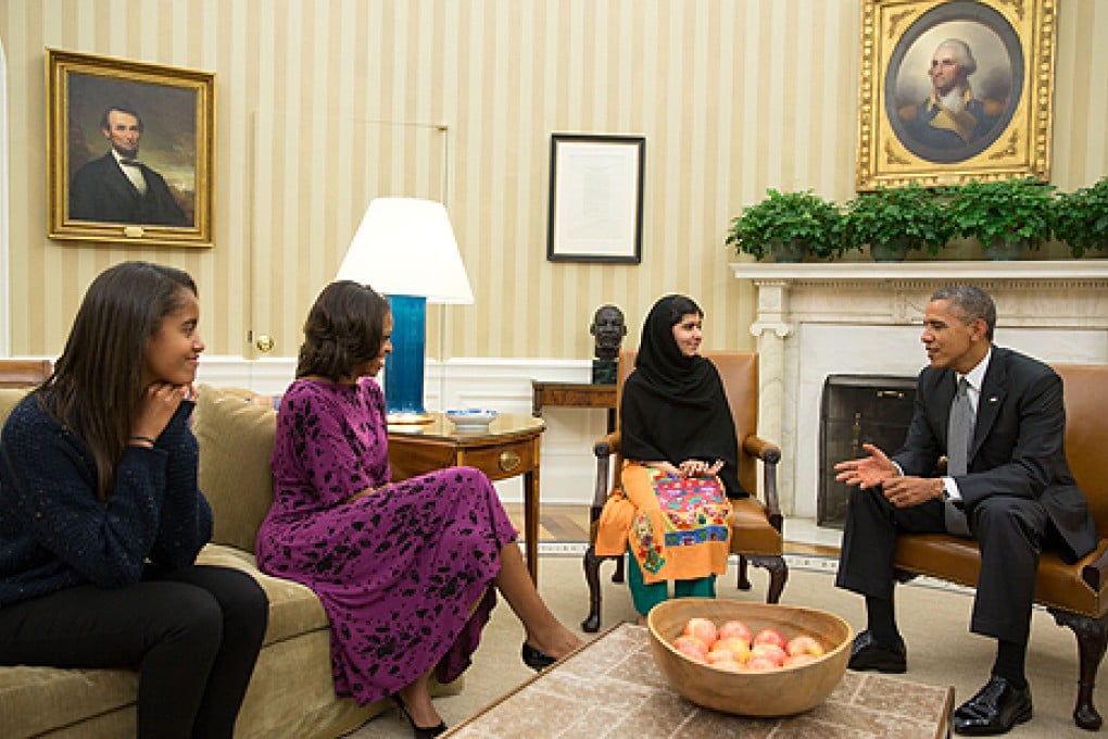 Malia Obama (left) joined her parents Michelle Obama and Barack Obama, at the Oval Office to meet education activist Malala Yousafzai. Photo: AFP