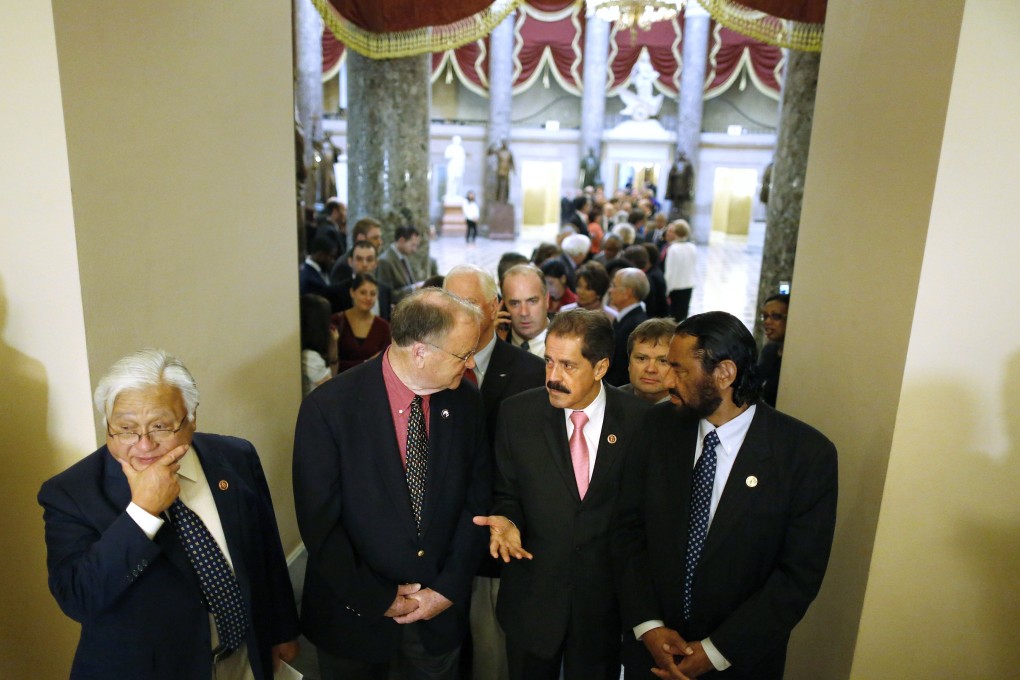 US House Democrats line up to march onto the House floor to address the government shutdown, at the US Capitol in Washington. Photo: Reuters