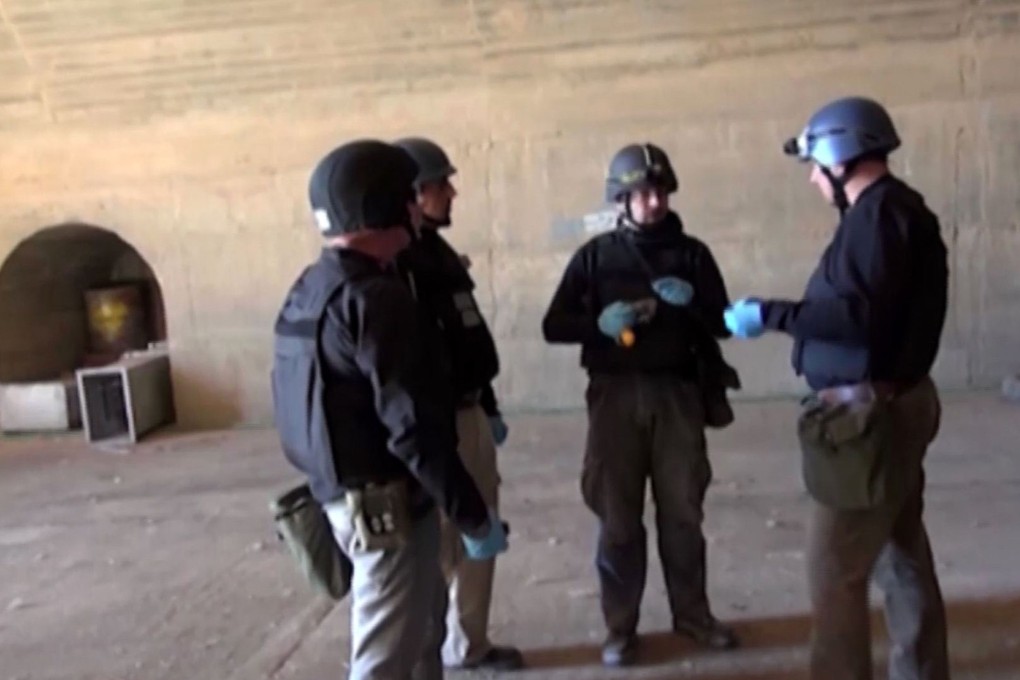 Inspectors from the Organisation for the Prohibition of Chemical Weapons (OPCW) at work in Syria. Photo: AFP