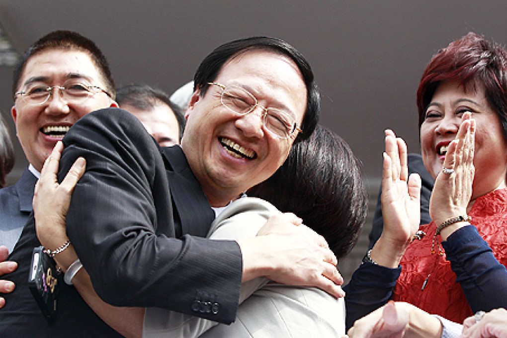 Taiwan's Premier Jiang Yi-huah (second left) hugs Nationalist Party lawmaker Chen Shu-Huey at the Legislative Yuan in Taipei on Tuesday. Photo: Reuters