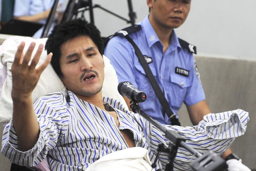 Ji Zhongxing gestures as he speaks during his trial in Beijing in September. Photo: Xinhua