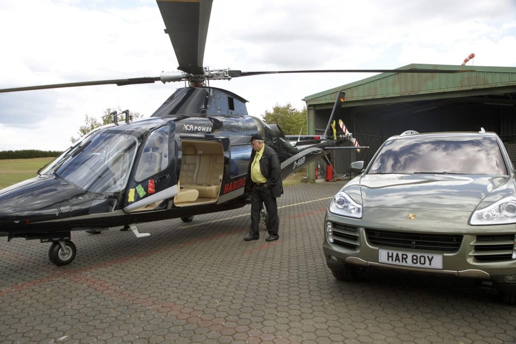 Hans Riegel in August at a golf course in Germany with some of the toys he was able to afford thanks to understanding children's tastes. Photo: EPA