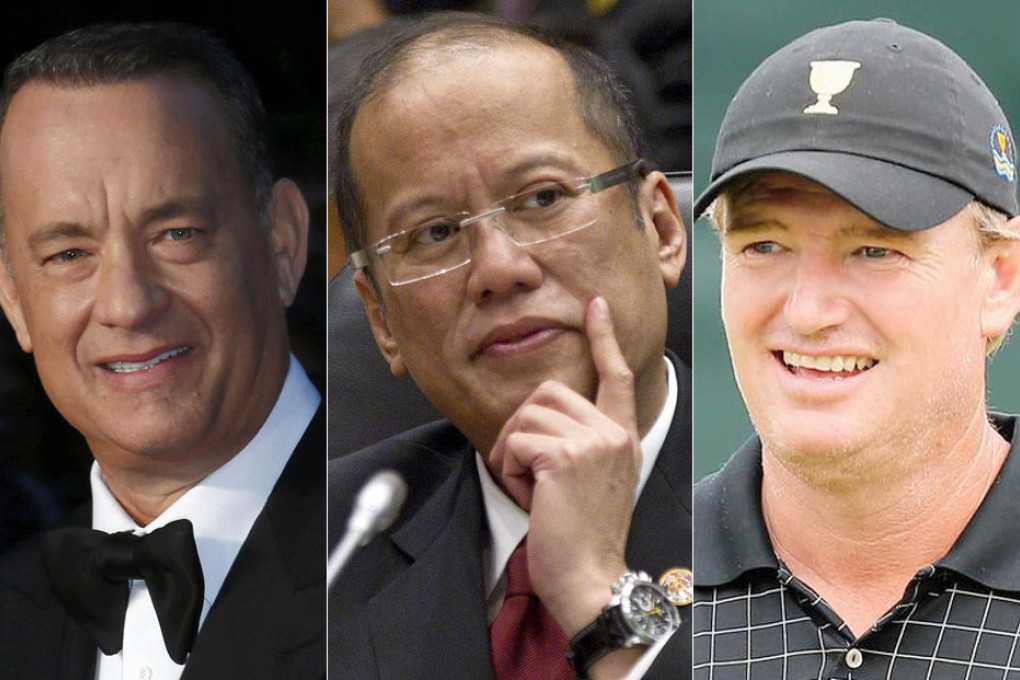 From left to right: Tom Hanks, Philippine President Benigno Aquino, and South African golfer Ernie Els.