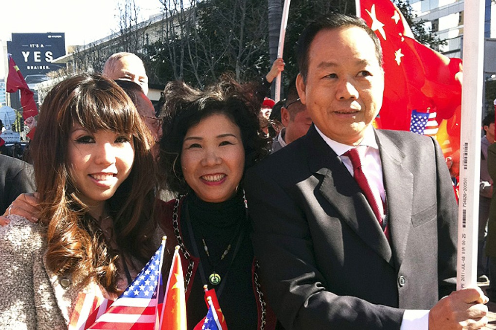 Chinese-American businessman Vincent Wu (right) poses for a photo with his wife Yip Lai Fong (centre) and daughter Anna Wu as they wait to welcome then-Vice President Xi Jinping on his visit to Los Angeles, California. Photo: AP