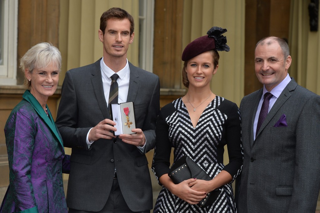 Andy Murray with his parents Judy (left) and Will, and his long-time girlfriend Kim Sears at Buckingham Palace on Thursday. Photo: EPA