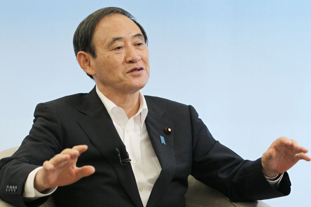Japan's Chief Cabinet Secretary Yoshihide Suga said officials at various levels from Japan and China had been holding secret talks recently. Photo: Bloomberg