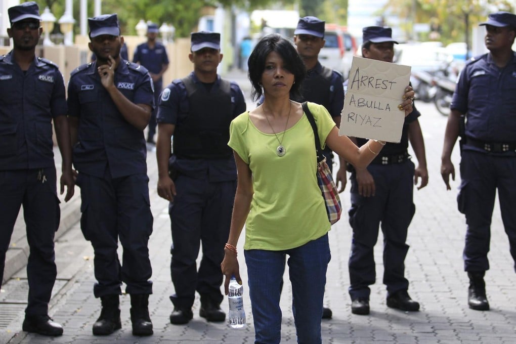 A supporter of presidential candidate Mohamed Nasheed joins a protest in Male against police after they stopped an election.Photo: Reuters
