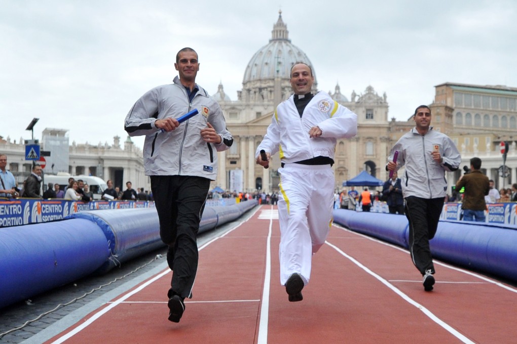 Competitors take part in a "Race of Faith" in St Peter's Square at the Vatican on Sunday. Photo: AFP