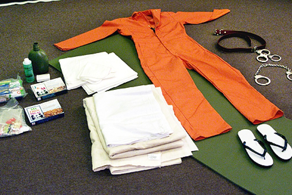 Items given to detainees at Guantanamo Bay. Pink uniforms may be issued to members motorcycle gangs imprisoned in Queensland. Photo: Reuters