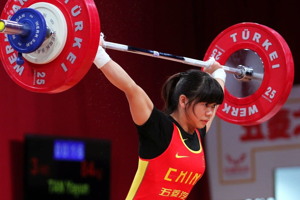 Tan Yayun snatches 84kg in the 48kg category at the world championships. Photo: EPA