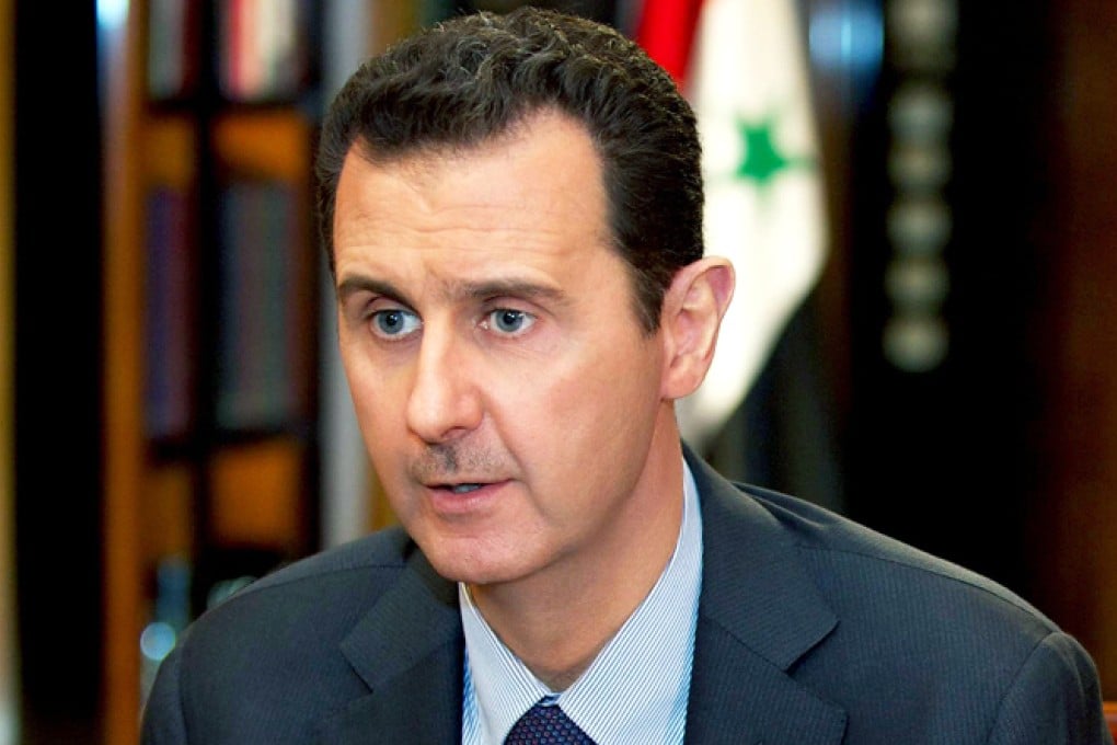 President Bashar al-Assad speaking during a television interview in Damascus on Sunday. Photo: EPA