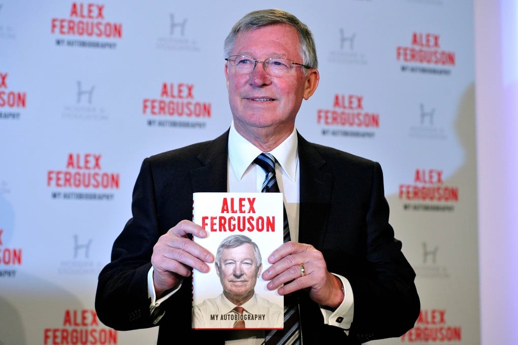 Alex Ferguson poses with a copy of his book at a press conference in London. The book lifts the lid on his relationships with stars such as David Beckham, Cristiano Ronaldo, Roy Keane and Wayne Rooney. Photo: AFP