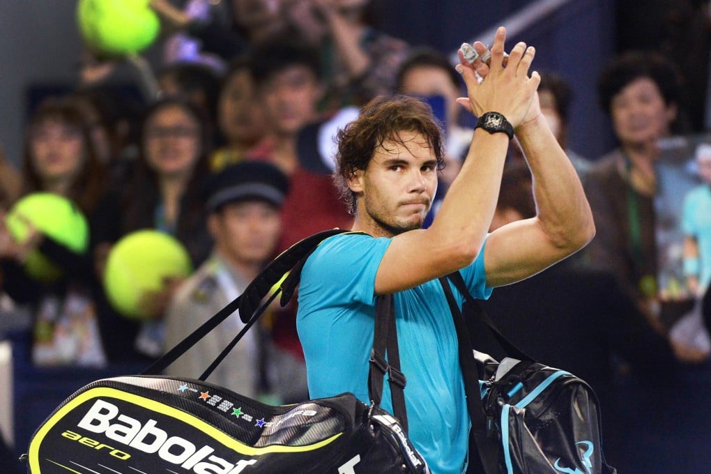 World number one Rafael Nadal of Spain leaves the court after being beaten by Juan Martin Del Potro of Argentina at the Shanghai Masters. Photo: AFP