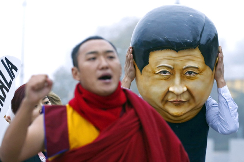 A protester mocks president Xi Jinping in Geneva. Photo: Reuters