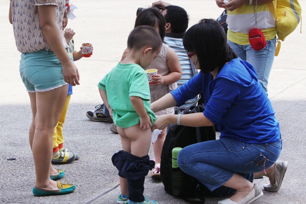 The Vancouver row finds echoes in Hong Kong. This mainland boy was pictured urinating into a plastic bag in Wan Chai on National Day. Photo: Nora Tam