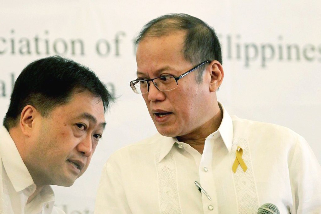 Benigno Aquino (right) with Finance Secretary Cesar Purisima at a media forum yesterday. Photo: EPA