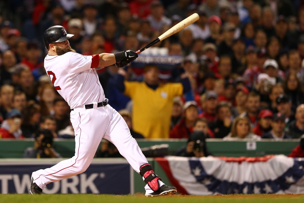 Mike Napoli hits a three-run double to lead the Boston Red Sox to an 8-1 thrashing of the St Louis Cardinals in game one of the World Series. Photo: AFP