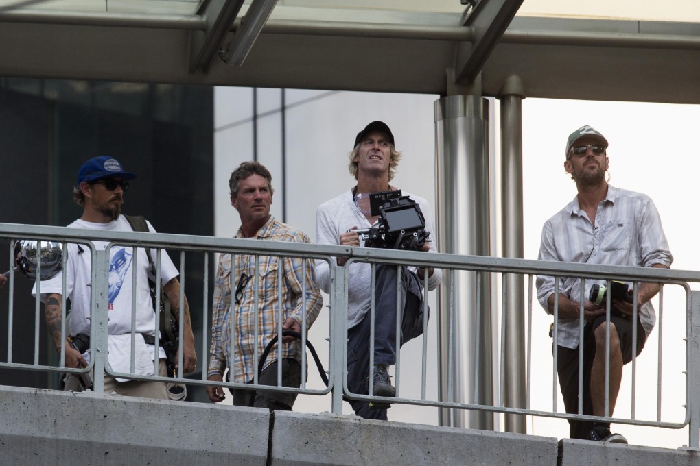 US director and producer Michael Bay holds a camera during the filming of a scene for the movie 'Transformers: Age of Extinction' at Hong Kong's Central District. Photo: Reuters