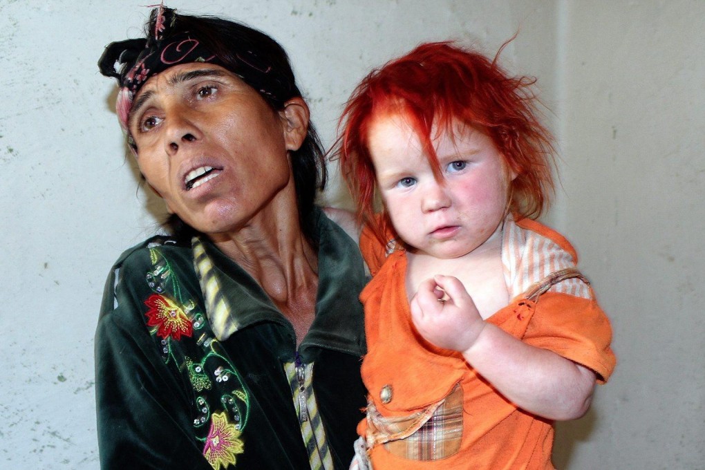 Roma mother Sasha Ruseva with one of her children. Photo: EPA