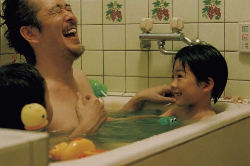 Lily Franky (above) and Masaharu Fukuyama (below), both with child actor Keita Ninomiya, in scenes from Like Father, Like Son.