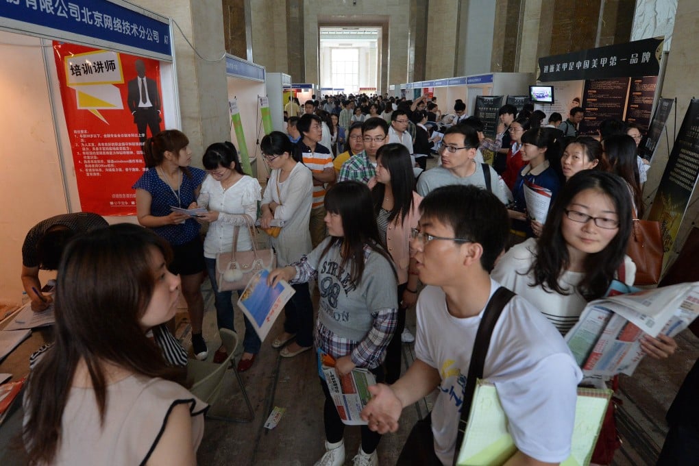 Graduates attend a jobs fair in Beijing. Photo: AFP