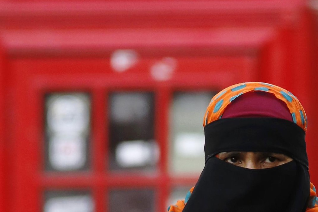 The burqa, all-concealing and "stifling". Photo: Reuters