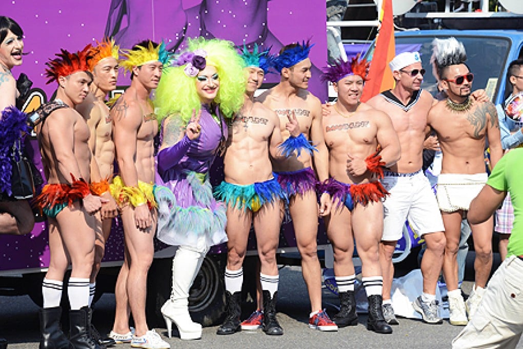 Attendees pose during the annual gay parade in Taipei on Saturday. Photo: AFP