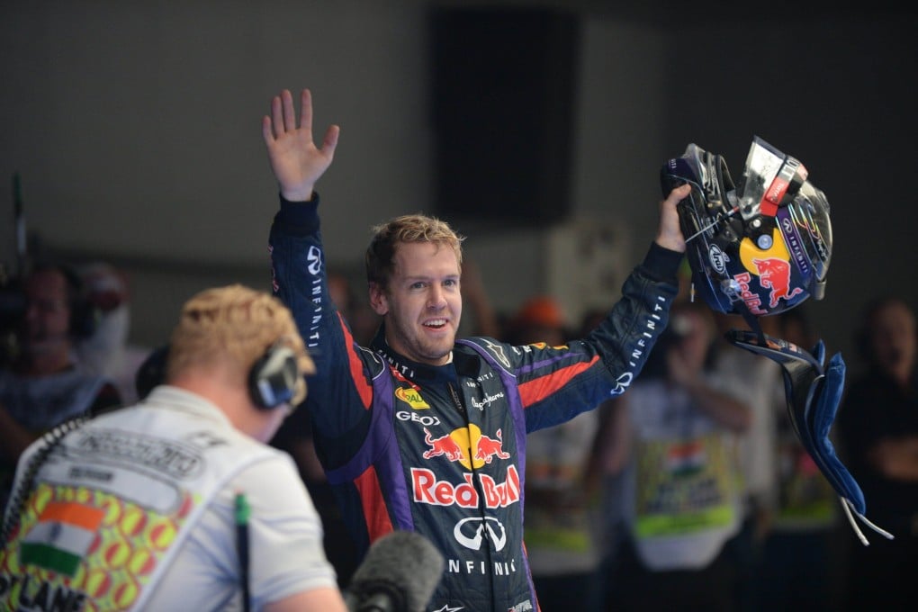 Sebastian Vettel celebrates after winning his fourth straight Formula One title. Photo: AFP
