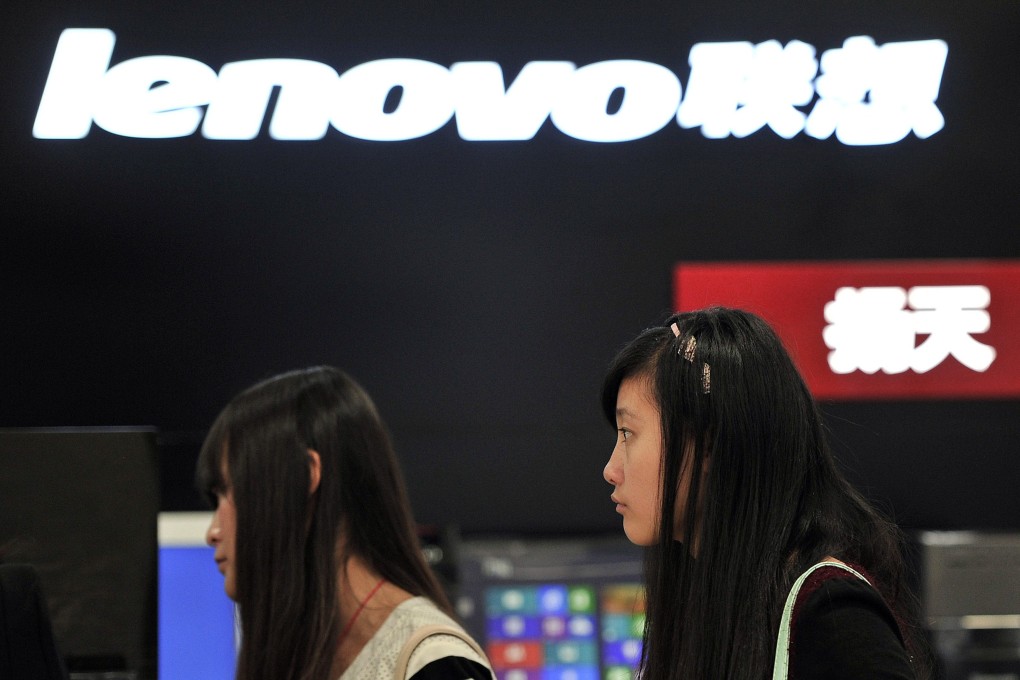 People walk past a Lenovo shop in Hefei, Anhui province. Photo: Reuters