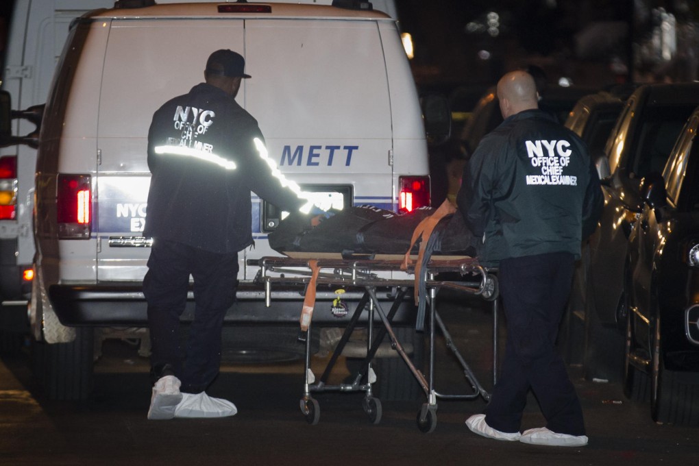 A body is taken away. Photo: AP