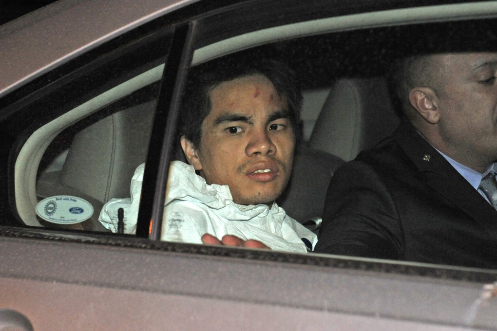 Mingdong Chen is taken into police custody. Photo: AP