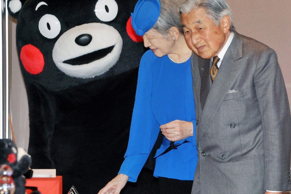 Emperor Akihito and Empress Michiko meet popular mascot Kumamon. Photo: AFP