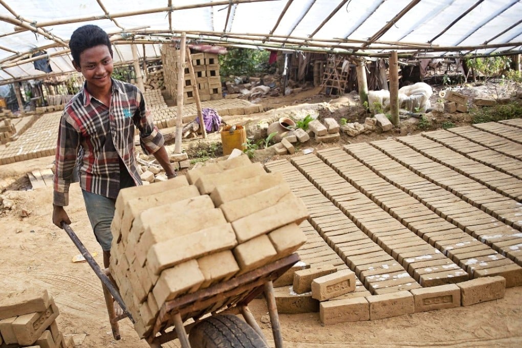 Brick makers in Yangon use home-made machines or thirty- to forty-year-old German machines, says businessman Dixon Chan. Photo: AFP