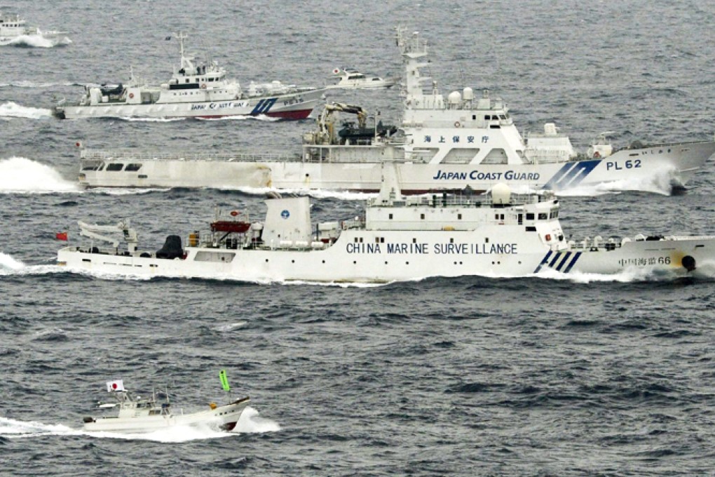 A China Coast Guard vessel (front) sails near a Japan Coast Guard vessel near the disputed islands, known as Diaoyus in China. Photo: Reuters