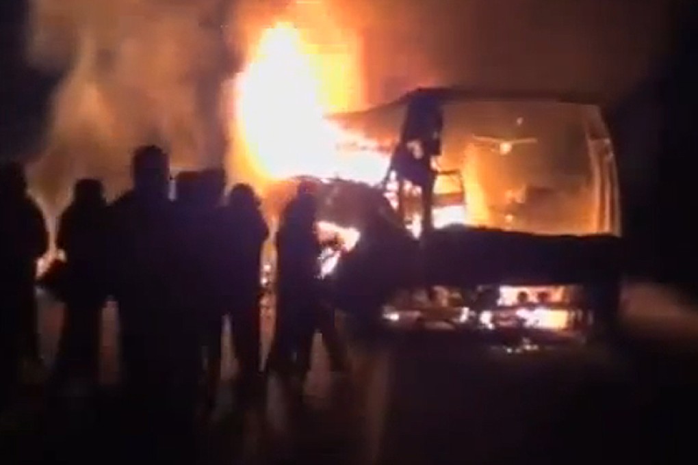 A still from TV of the burning bus. Photo: SCMP