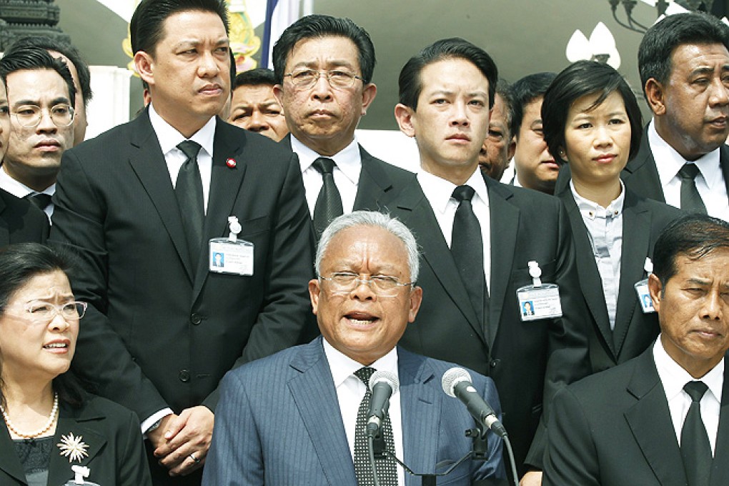 Thailand's opposition Democrat Party member of Parliament and former secretary general of the party Suthep Thaugsuban (centre) talks during a press conference at Parliament in Bangkok, Thailand, on Wednesday. Photo: EPA